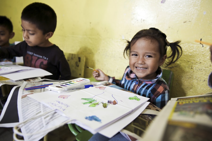 Smiling preschool child with artwork